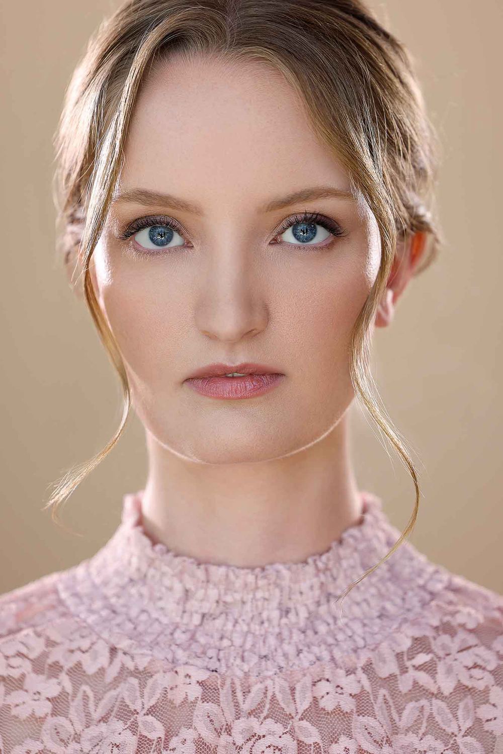Close-up headshot of Chelsey Kaye in a pink lace top